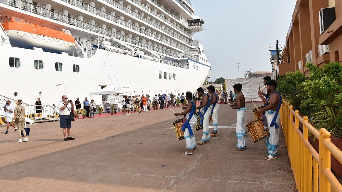 Passengers of the cruise are welcomed with the traditional 'chende' being played at the New Mangalore Port.