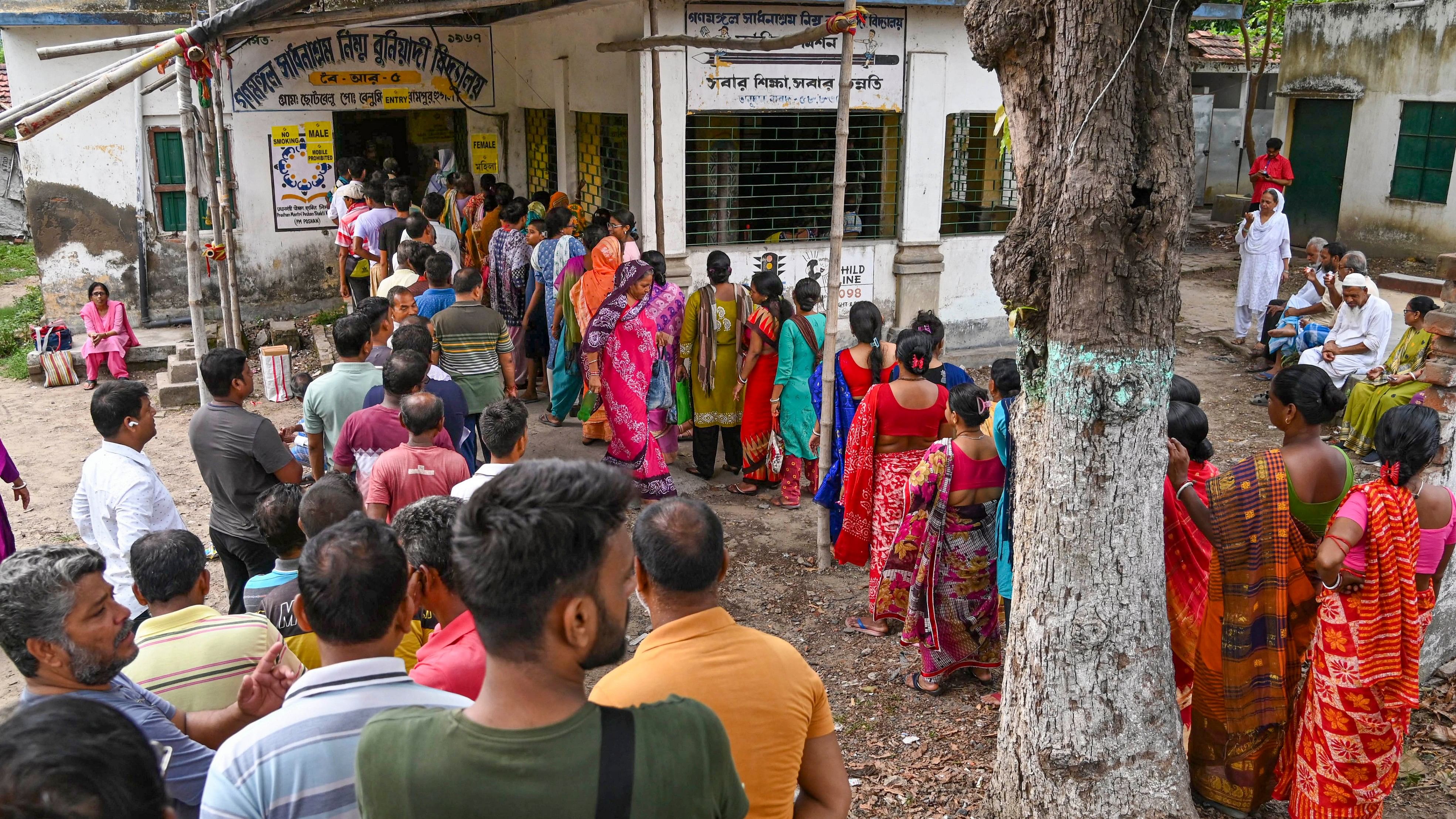 People queue up to vote during the fifth phase of Lok Sabha elections in Hooghly, West Bengal.