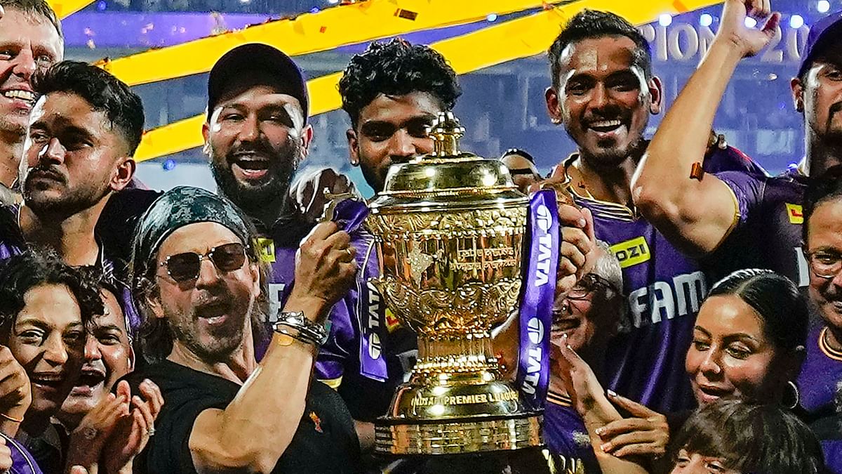 Actor and Kolkata Knight Riders co-owner Shah Rukh Khan celebrates the win with the players.