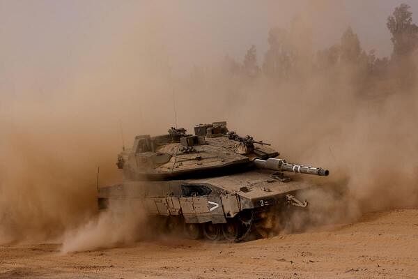 A tank manoeuvres near the Israel-Gaza border, amid the ongoing conflict between Israel and the Palestinian Islamist group Hamas, in Israel, May 27, 2024.