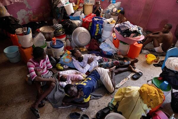 People displaced by gang war violence shelter at the Darius Denis school in Port-au-Prince.