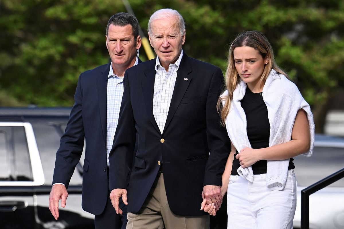 U.S. President Joe Biden and his granddaughter Finnegan Biden depart St. Edmond Roman Catholic Church in Rehoboth Beach
