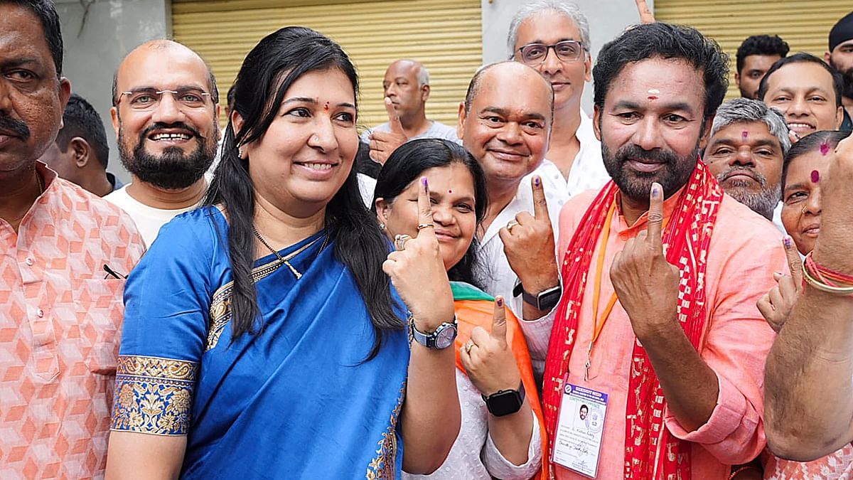 Telengana BJP chief G Kishan Reddy shows his inked finger after casting his vote along with his family members at a polling station during fourth phase of Lok Sabha polls, in Kacheguda, Secunderabad.