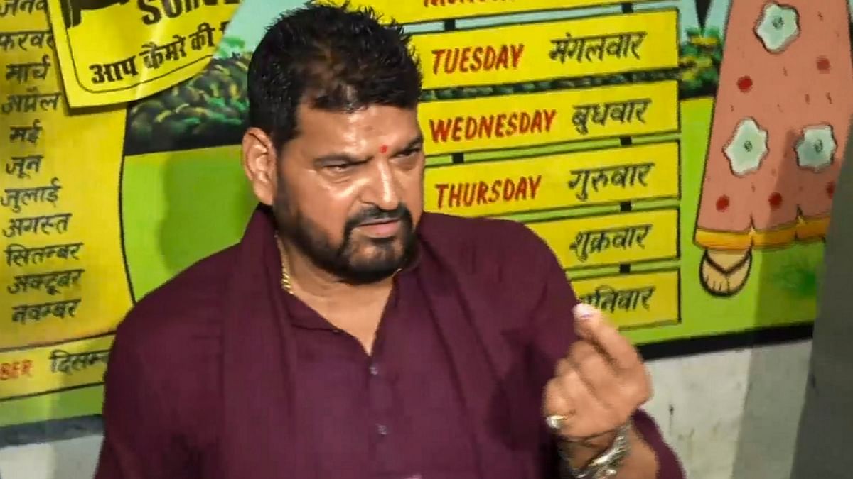 BJP leader Brij Bhushan Sharan Singh shows his inked finger after casting his vote for the fifth phase of Lok Sabha elections, in Gonda, Uttar Pradesh.