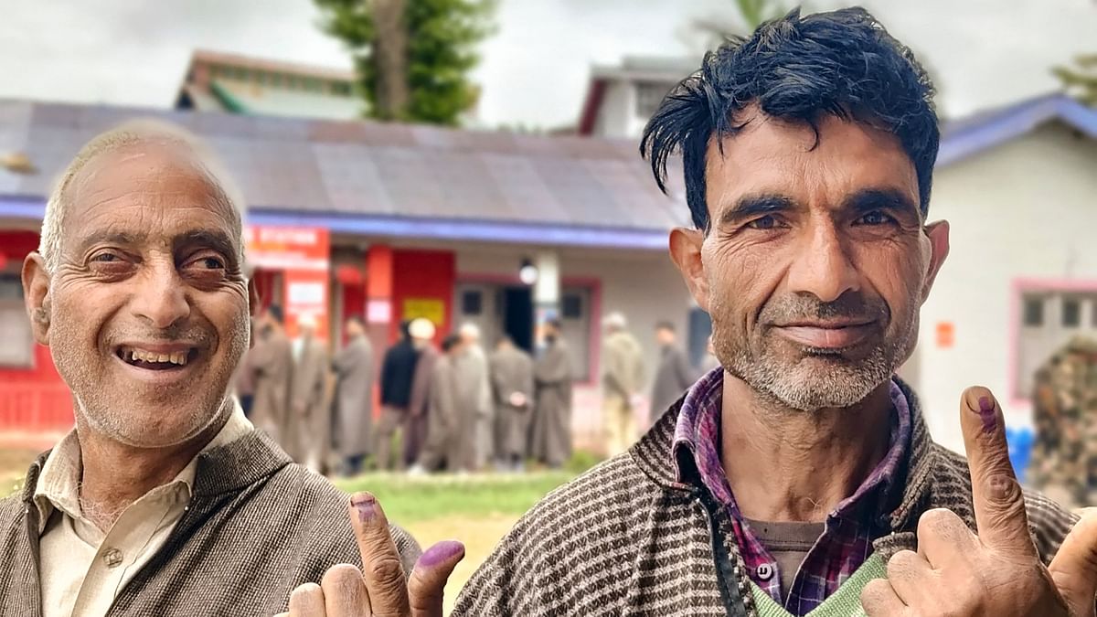 People show their inked fingers after casting their votes at a polling booth during the fourth phase of General Elections 2024 in Srinagar, J&amp;K.
