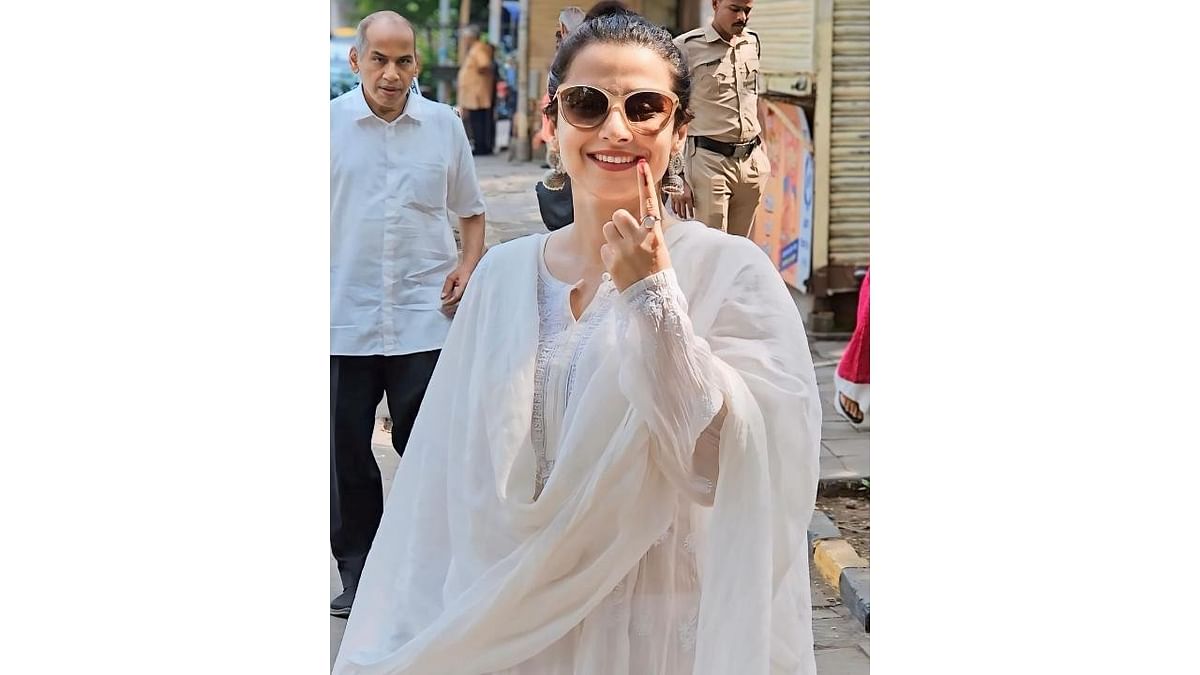 Actress Vidya Balan shows her ink marked finger after casting her vote for the fifth phase of Lok Sabha elections, in Mumbai.