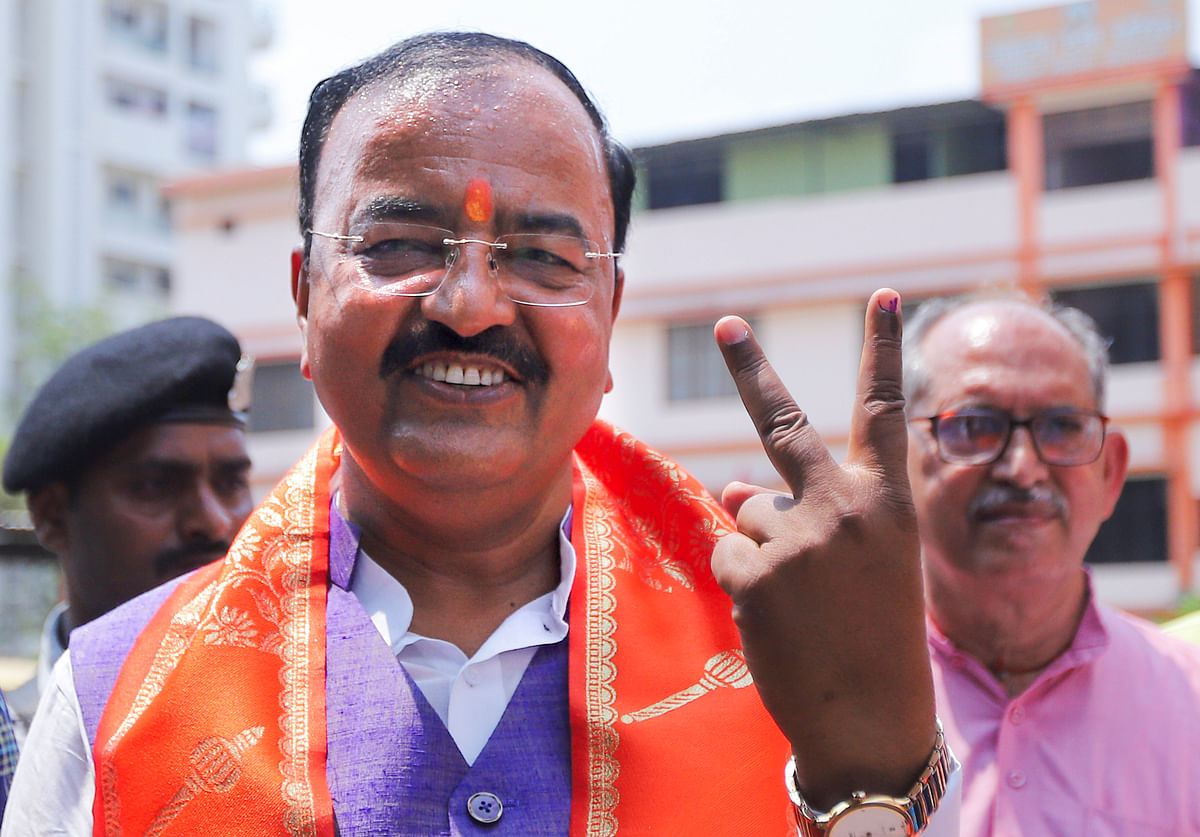 Uttar Pradesh Deputy Chief Minister Keshav Prasad Maurya shows his finger marked with indelible ink after casting his vote at a polling station during the sixth phase of the Lok Sabha elections, in Prayagraj, On Saturday.