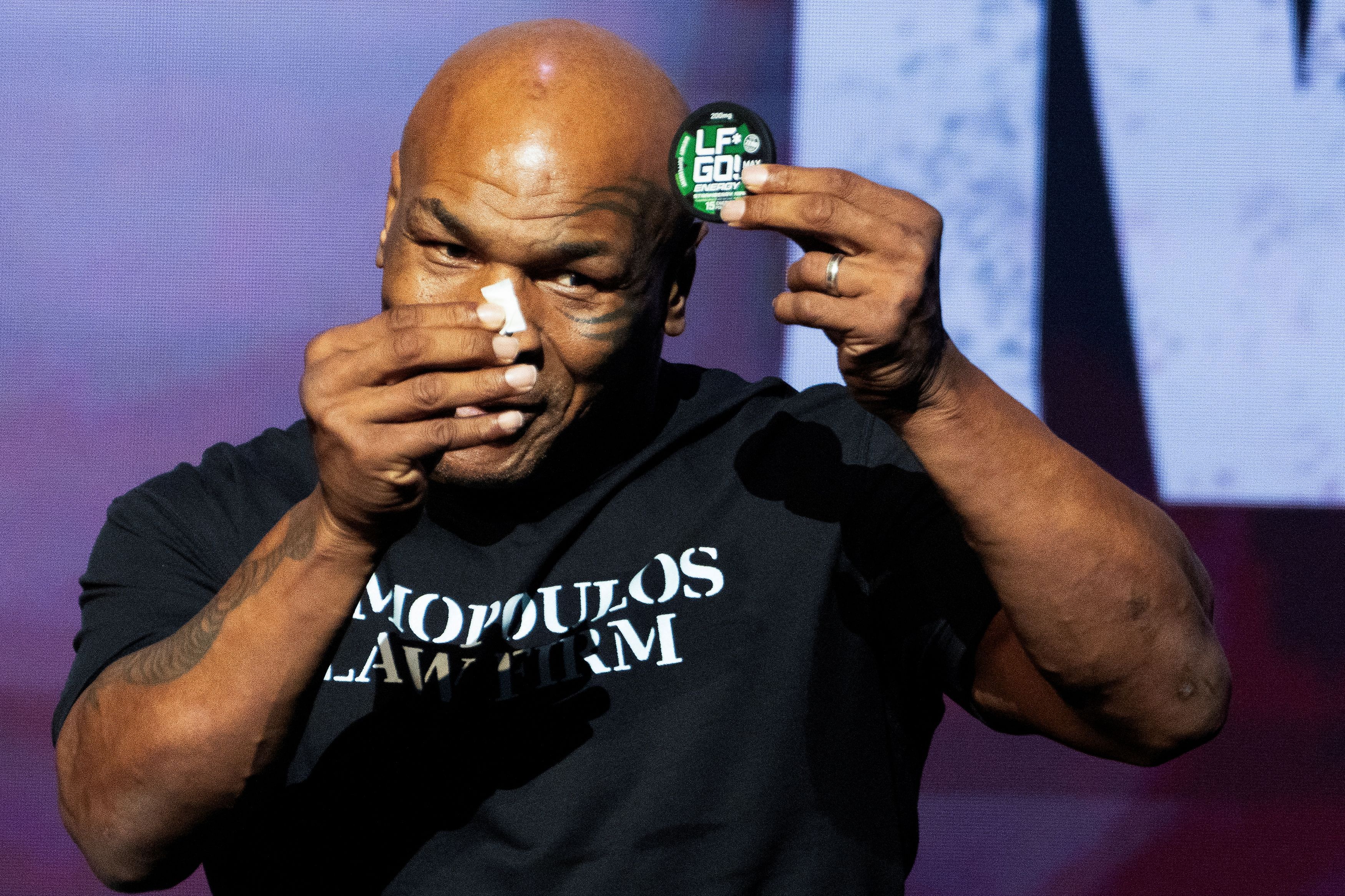 Boxer Mike Tyson promotes one of his energy products during a news conference, ahead of a sanctioned professional fight against Jake Paul which is set to take place at AT&T Stadium in Arlington, Texas on July 20, in New York City