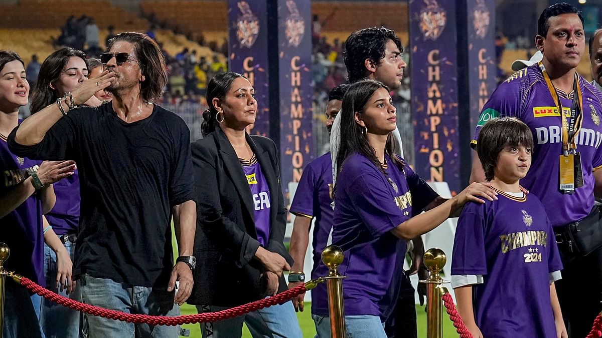 Shah Rukh Khan and his family greet audience during the victory lap after his team KKR's victory.