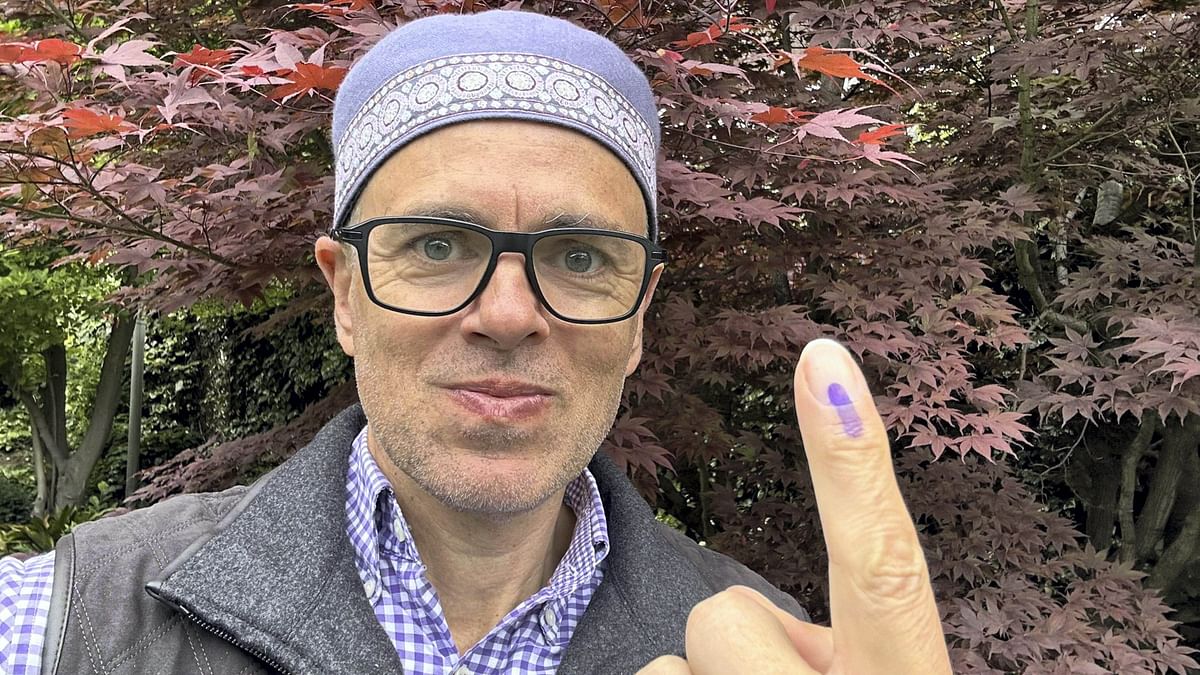 J&amp;K NC leader Omar Abdullah shows his inked finger after casting his vote at a polling station during the fourth phase of Lok Sabha polls, in Srinagar.