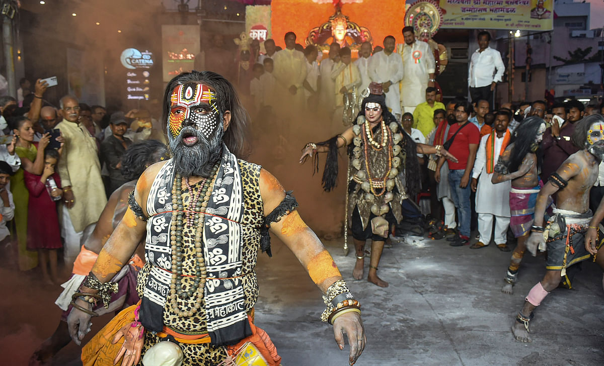 An artist performs during the Basaveshwar Jayanti procession, in Solapur district.
