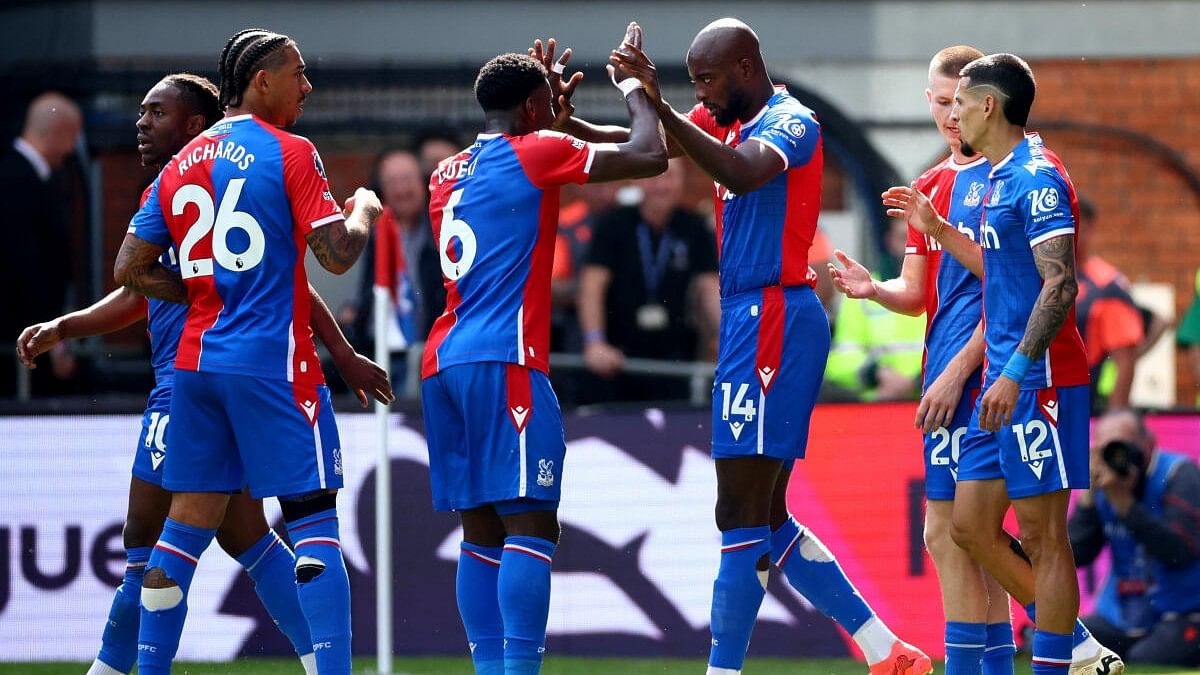 Crystal Palace's Jean-Philippe Mateta celebrates scoring a goal with teammate Marc Guehi.