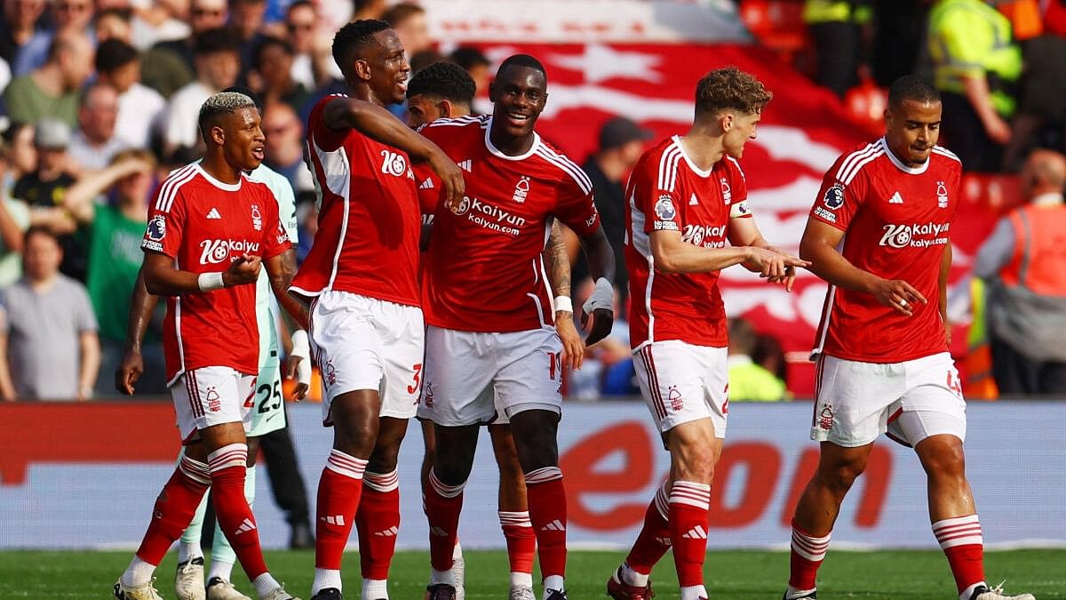 Nottingham Forest's Willy Boly celebrates scoring a goal with teammates.