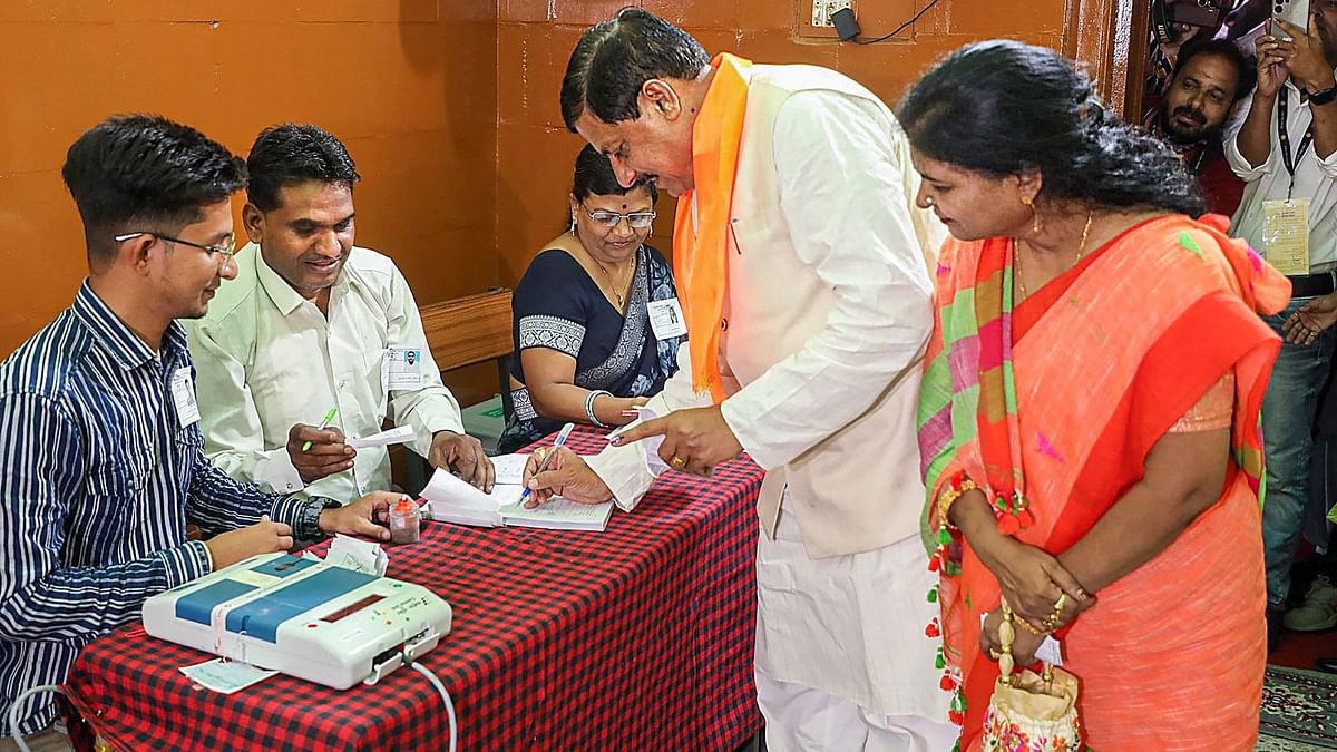 Madhya Pradesh Chief Minister Mohan Yadav with wife go through the election procedure to cast their vote during the fourth phase of Lok Sabha elections, in Ujjain.