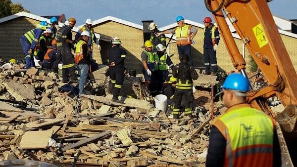 At least five killed, dozens trapped in building collapse in South Africa