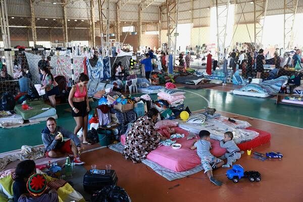 People who have been evacuated from flooded areas rest in a shelter at a university in Canoas, Rio Grande do Sul state, Brazil.