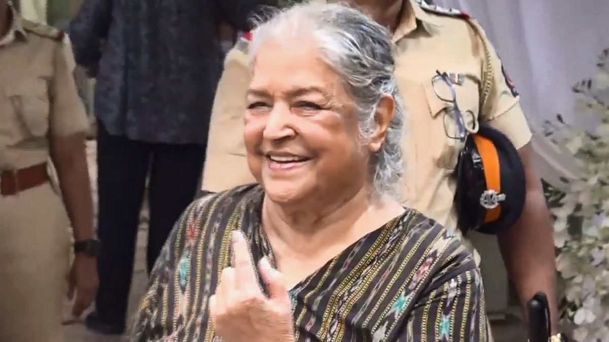 Veteran actor Shobha Khote shows her inked finger after casting her vote in Mumbai during the fifth phase of Lok Sabha elections.