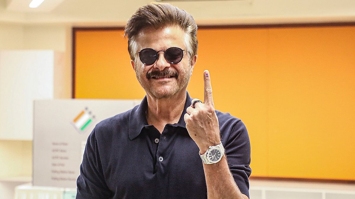 Actor Anil Kapoor shows his finger marked with indelible ink after casting vote for the fifth phase of Lok Sabha elections, in Mumbai.