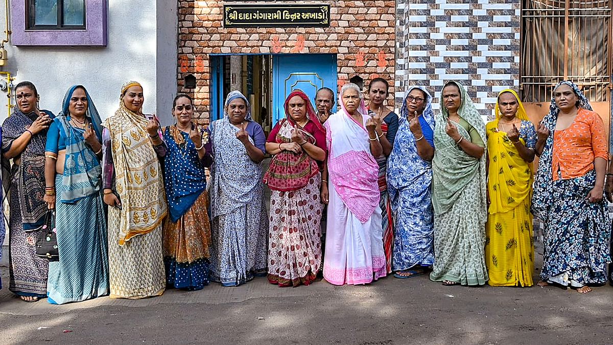 Transgender voters show their inked fingers during the third phase of Lok Sabha polls, in Kheda, Gujarat.