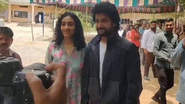 Actor Nani and his wife pose outside a polling booth after casting their vote in the fourth phase of Lok Sabha Elections.