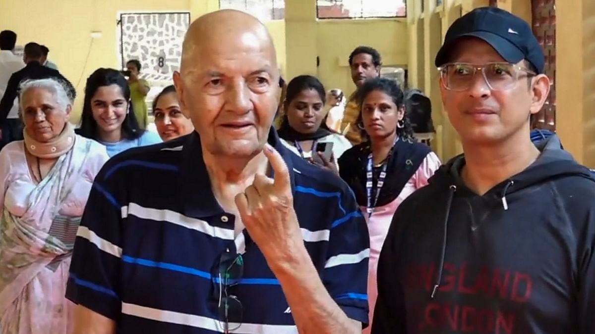 Veteran actor Prem Chopra with his son-in-law and actor Sharman Joshi after casting his vote during the fifth phase of Lok Sabha elections, in Mumbai.