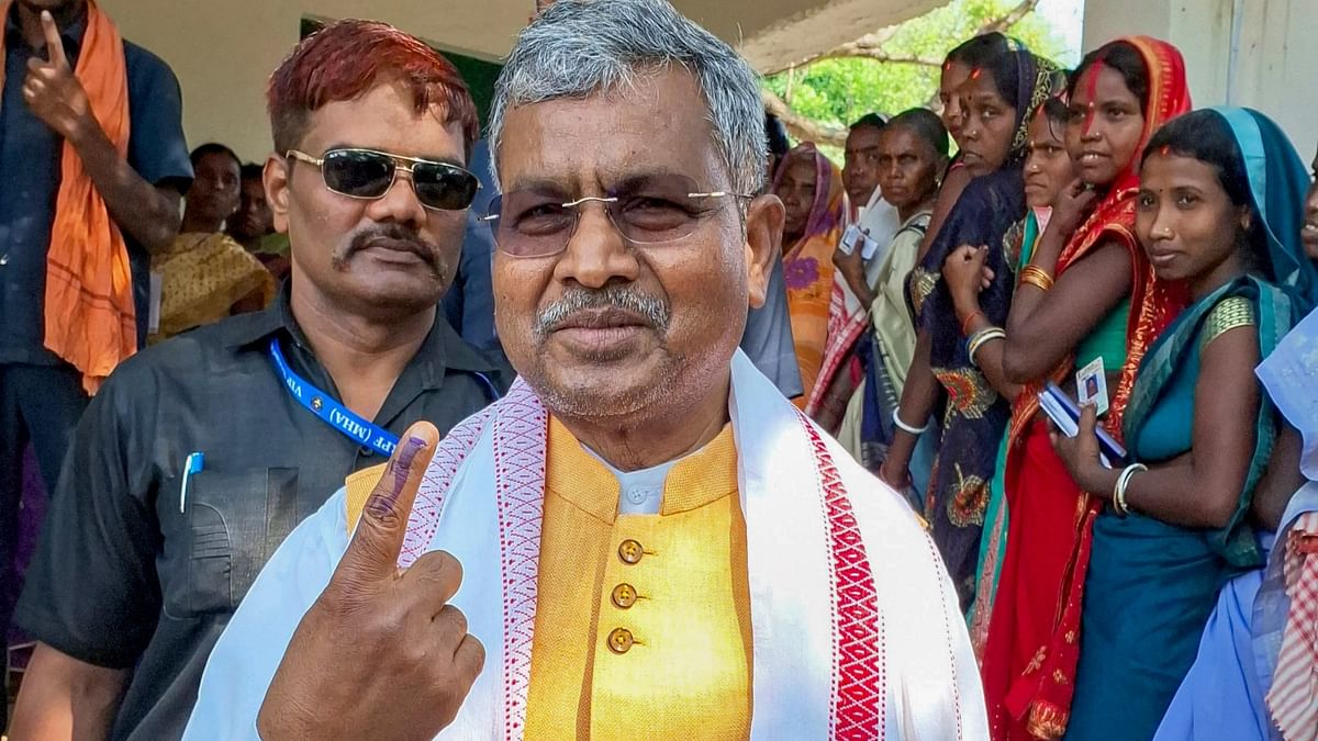 Jharkhand BJP President Babulal Marandi shows his inked finger after casting his vote during the Gandey assembly seat by-polls, in Giridih district, Jharkhand.