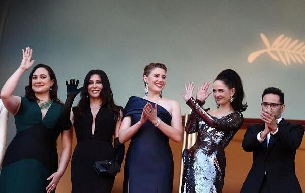 Greta Gerwig, Jury President of the 77th Cannes Film Festival, and Jury members, Lily Gladstone, Nadine Labaki, Eva Green and Juan Antonio Bayona pose on the red carpet to attend the closing ceremony of the 77th Cannes Film Festival in Cannes, France, May 25