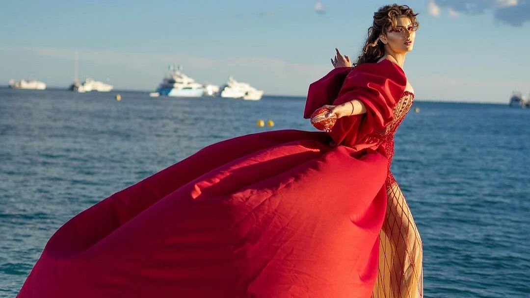 In her second appearance at the Cannes 2024, Urvashi Rautela wowed everyone in a shimmery red gown by a Tunisian designer.