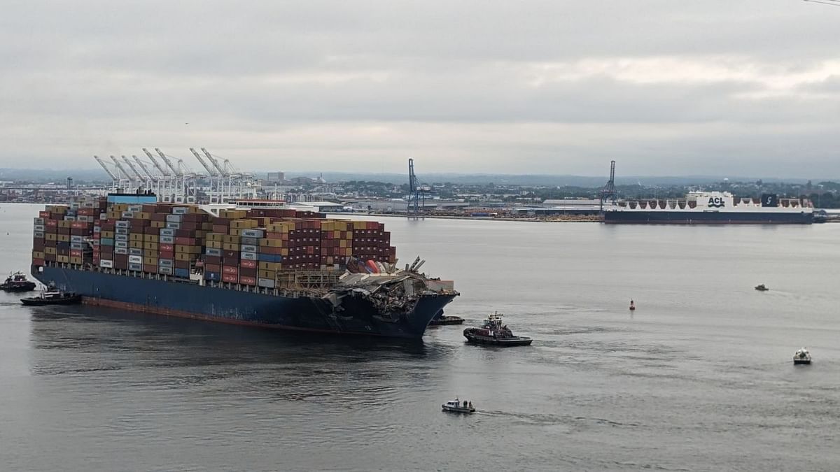 Crashed ship that took down Baltimore bridge refloated, towed from channel
