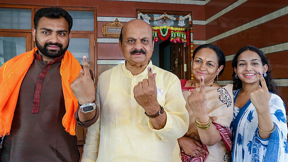 Former Karnataka CM and BJP candidate from Haveri Basavaraj Bommai with family members showing their inked fingers after casting votes at a polling station during the third phase of Lok Sabha polls, in Haveri.