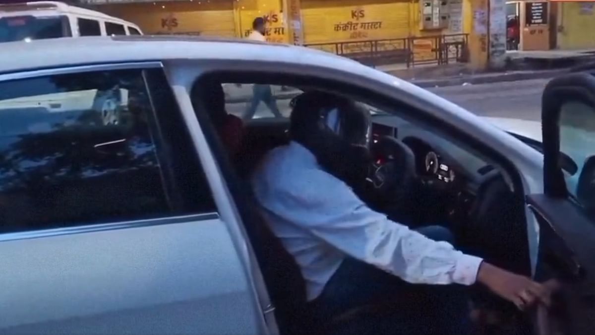 Fined Rs 1,000 for not wearing helmet, Uttar Pradesh man drives Audi with headgear on