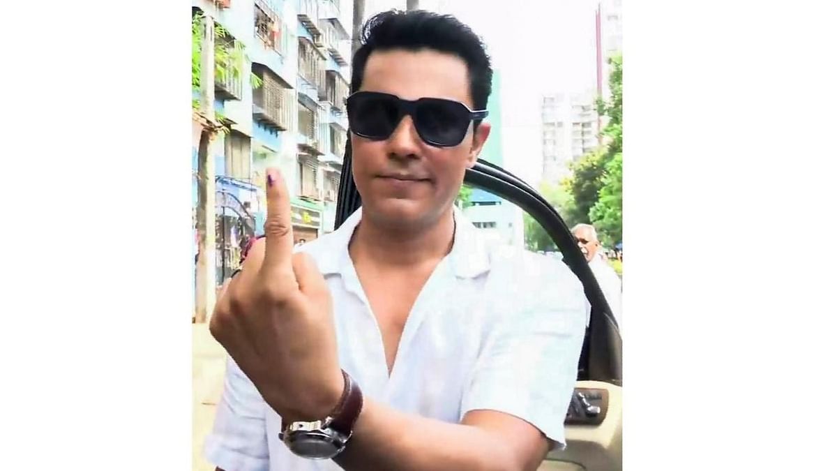 Bollywood actor Randeep Hooda shows his inked finger after casting his vote during the fifth phase of Lok Sabha elections, in Mumbai.