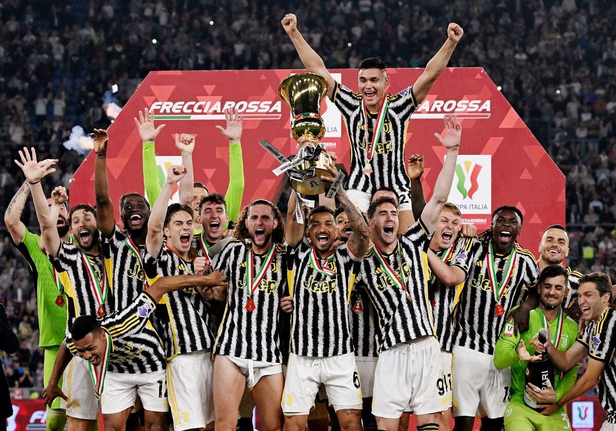  Atalanta v Juventus - Stadio Olimpico, Rome, Italy - May 15, 2024 Juventus' Danilo celebrates with the trophy and teammates after winning the Coppa Italia final 