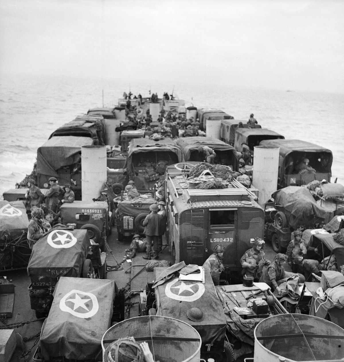 Troops and vehicles aboard an LCT head for the enemy coast, June 6, 1944