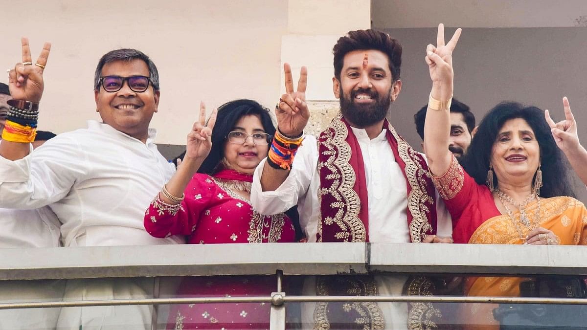 LJP (Ram Vilas) Chief Chirag Paswan shows victory sign during celebrations of the party's lead in the Lok Sabha elections as counting of votes underway, in Patna.