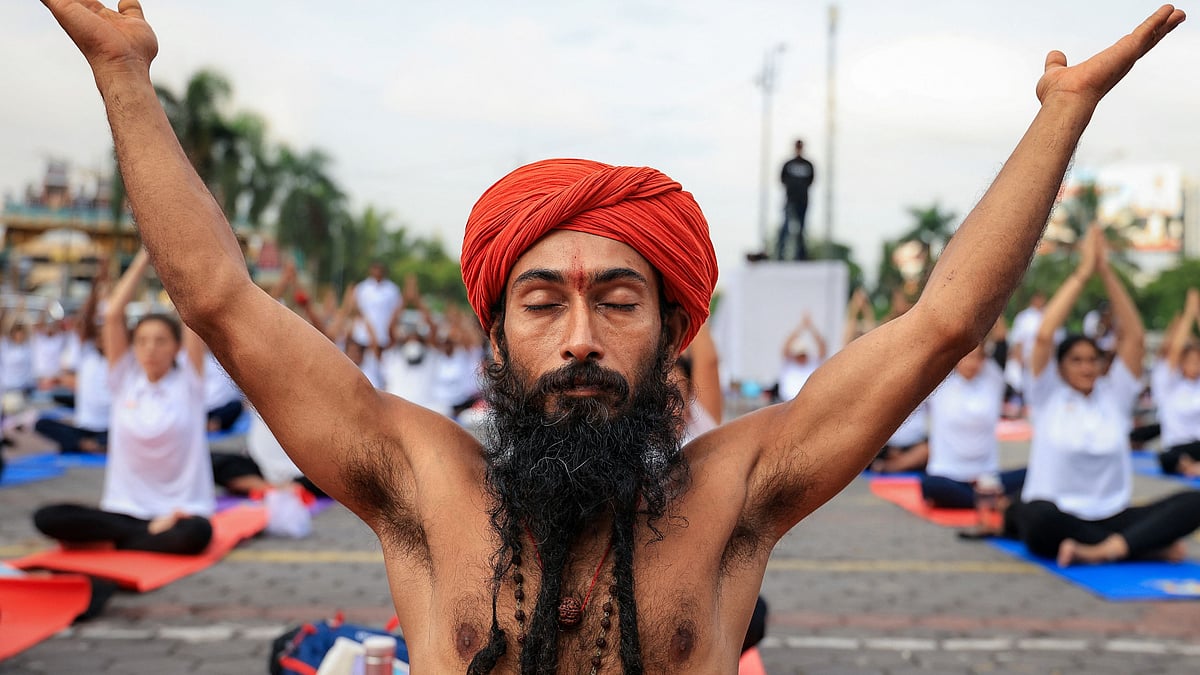 A sadhu takes part in a mass yoga session at Batu Caves in Malaysia.