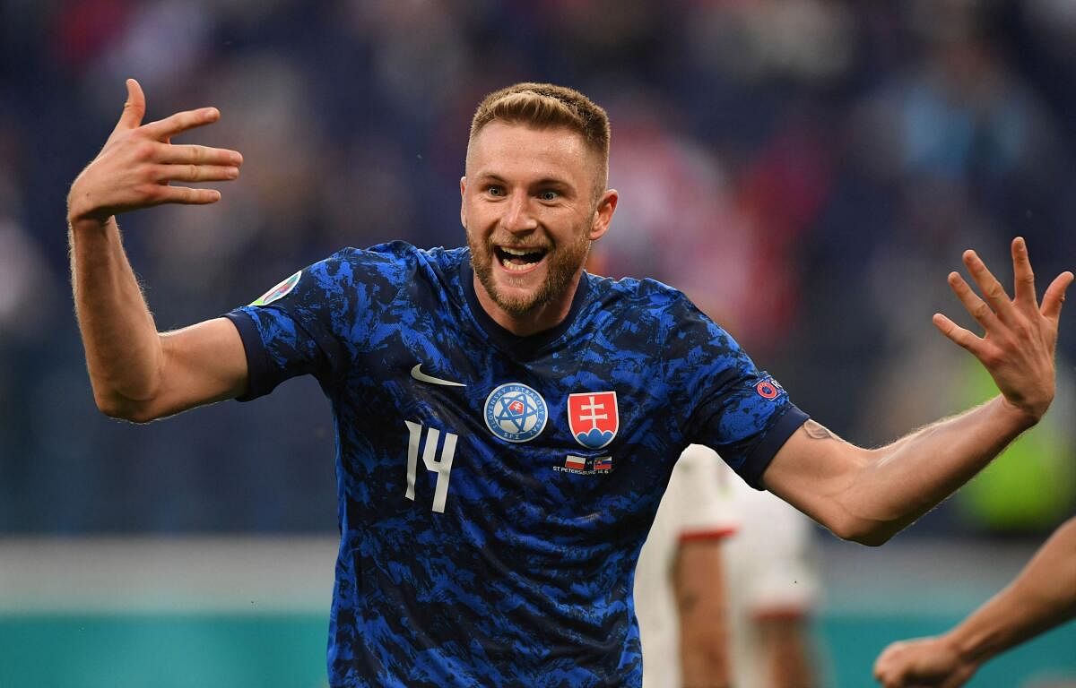 Slovakia's Milan Skriniar celebrates after scoring.