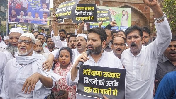 Delhi 'water crisis': Protesters wave placard at Atishi's Satyagraha site, AAP blames BJP
