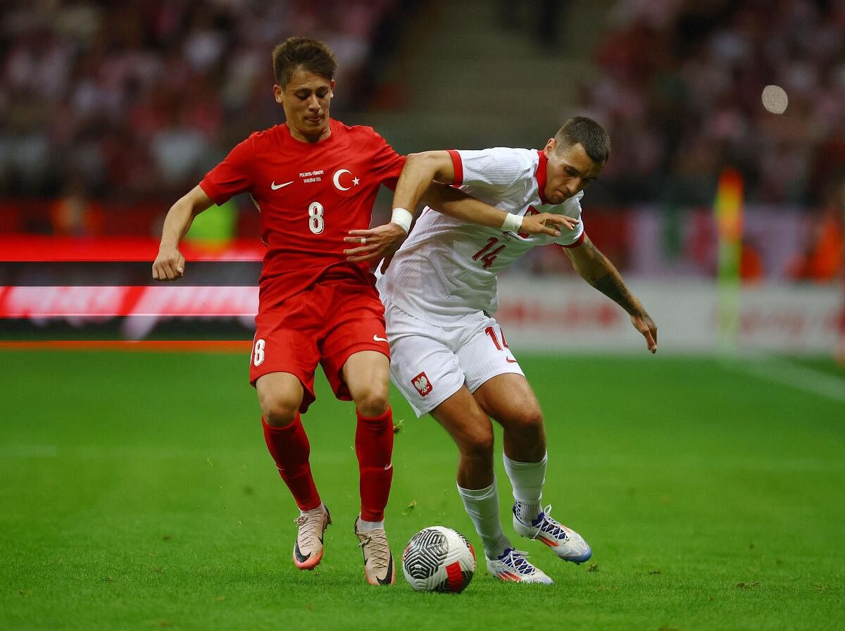 Turkey's Arda Guler (L) in action.