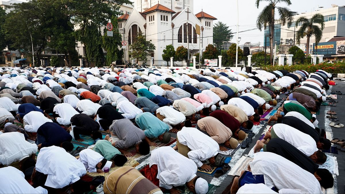 Muslims attend morning mass prayers during Eid ul-Adha celebrations in Jakarta.