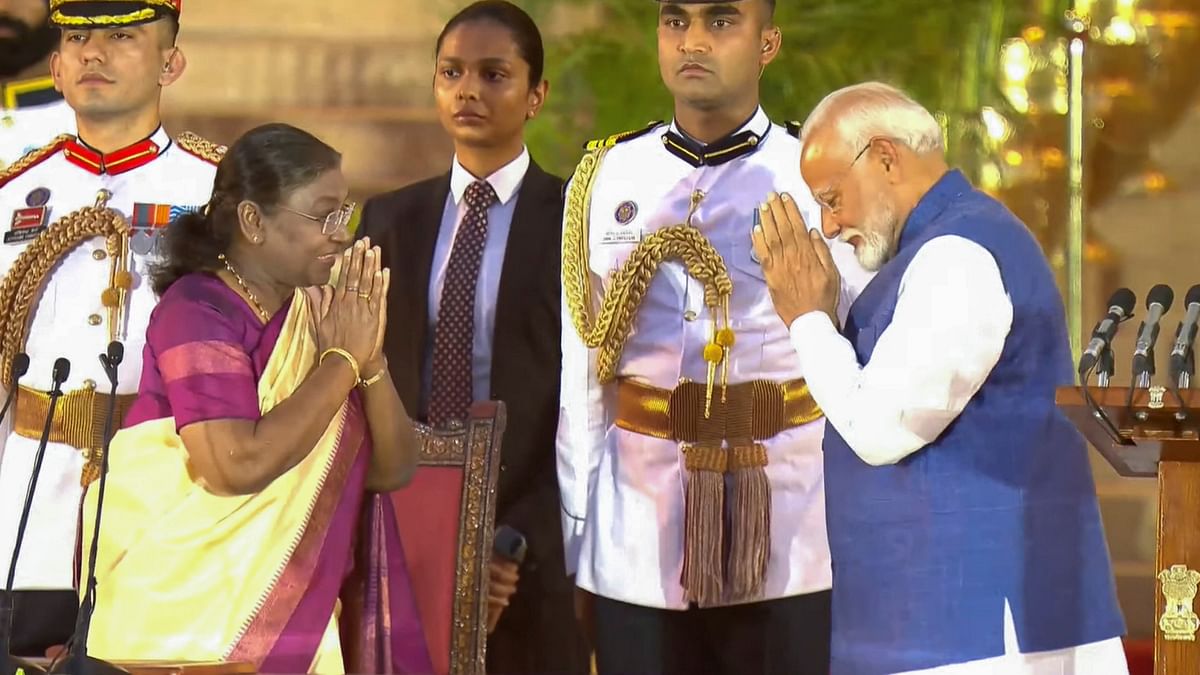 President Droupadi Murmu greets PM-designate Narendra Modi on his arrival to take oath for the third consecutive term, at Rashtrapati Bhavan in New Delhi.