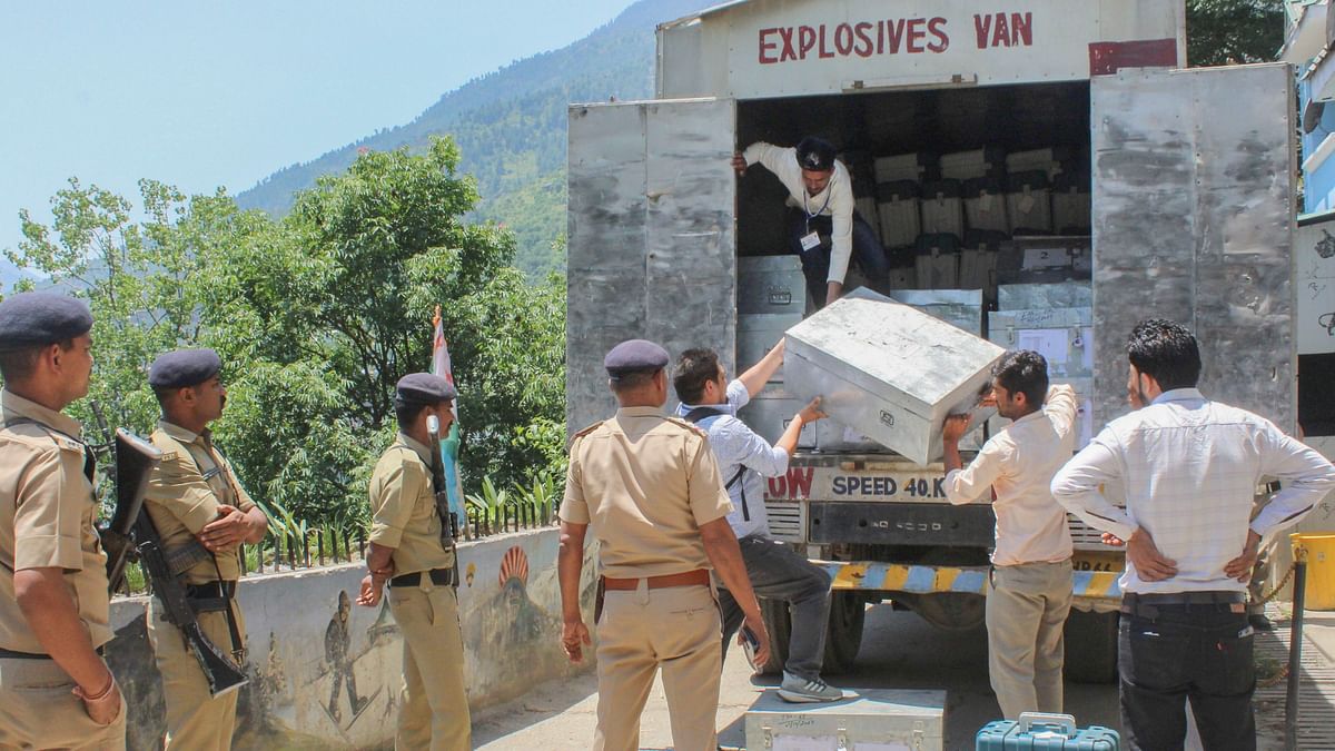 Voting Machines (EVMs) and other election material being brought to a strong room, following voting in the seventh and last phase of Lok Sabha elections, in Kullu.