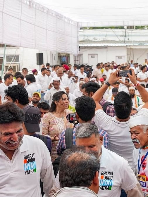 Congress party leaders and workers celebrate the early trends at party headquarters, in New Delhi.