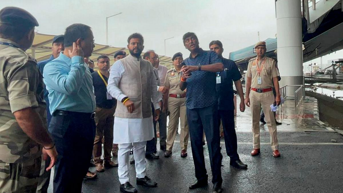 Civil Aviation Minister K Rammohan Naidu is seen inspecting the accident area at the Delhi airport.