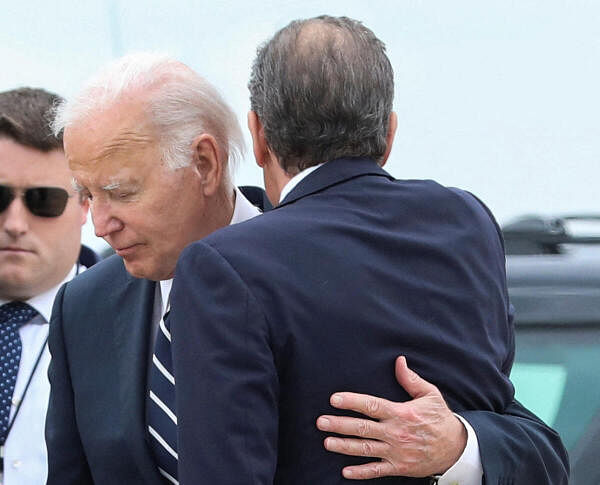 U.S. President Joe Biden embraces his son Hunter Biden, who earlier in the day was found guilty on all three counts in his criminal gun charges trial, as President Biden arrived at the Delaware Air National Guard Base in New Castle, Delaware.