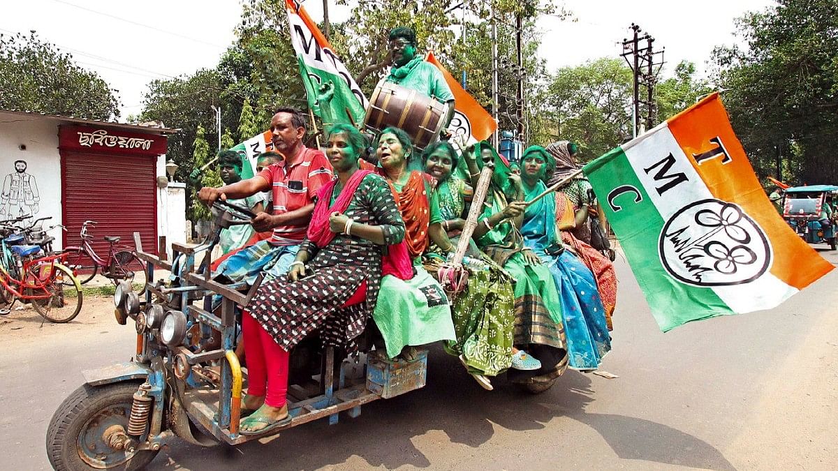 TMC supporters celebrate the party's lead during counting of votes for Lok Sabha elections, in Birbhum.