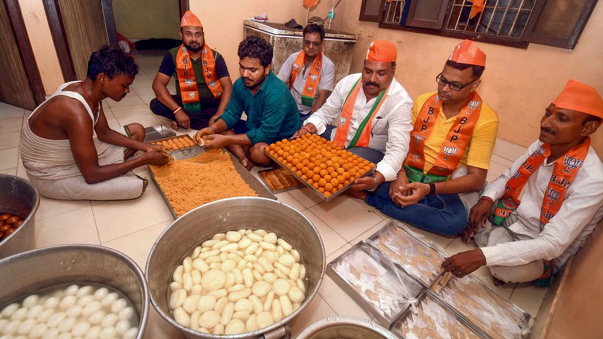 BJP workers prepare sweet ahead of vote counting of Lok Sabha elections, in Patna.