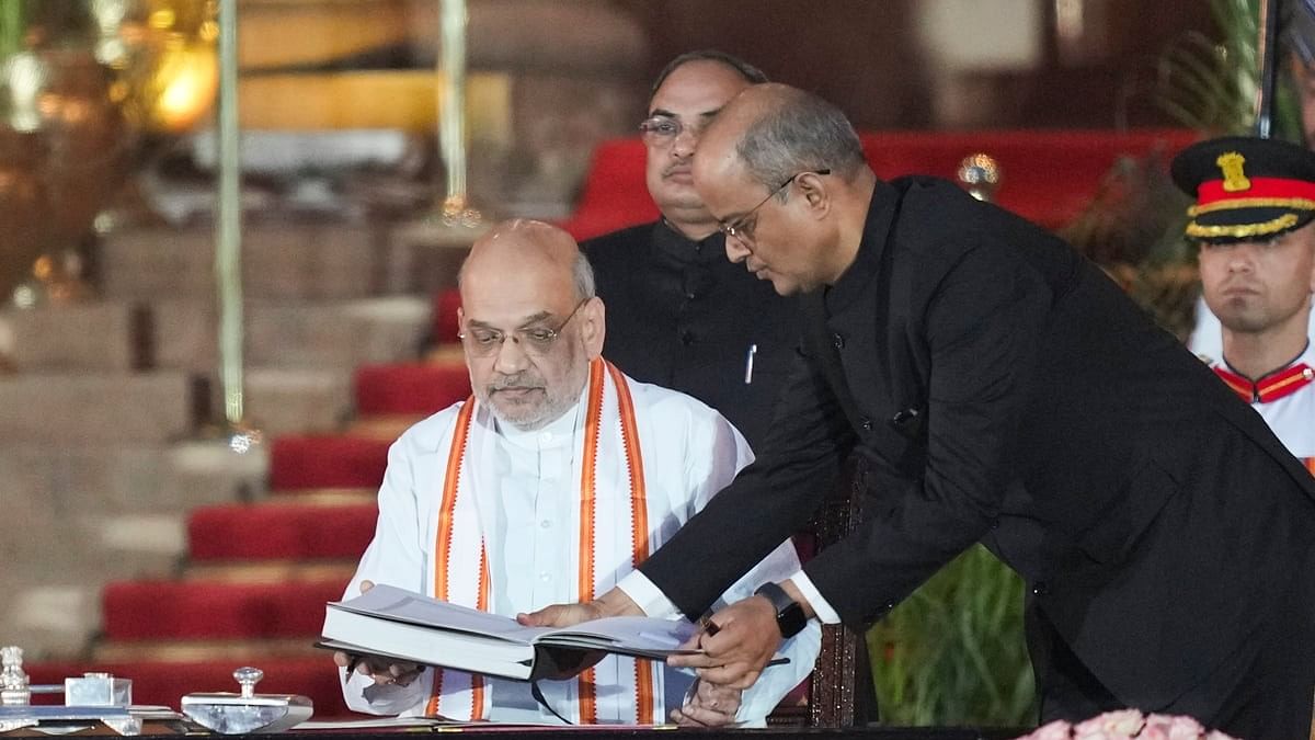 BJP MP Amit Shah takes oath as minister during the swearing-in ceremony of new Union government, at Rashtrapati Bhavan in New Delhi.