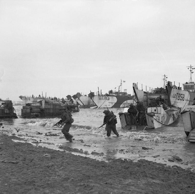 Commandos coming ashore from amphibious landing craft, June 6, 1944.