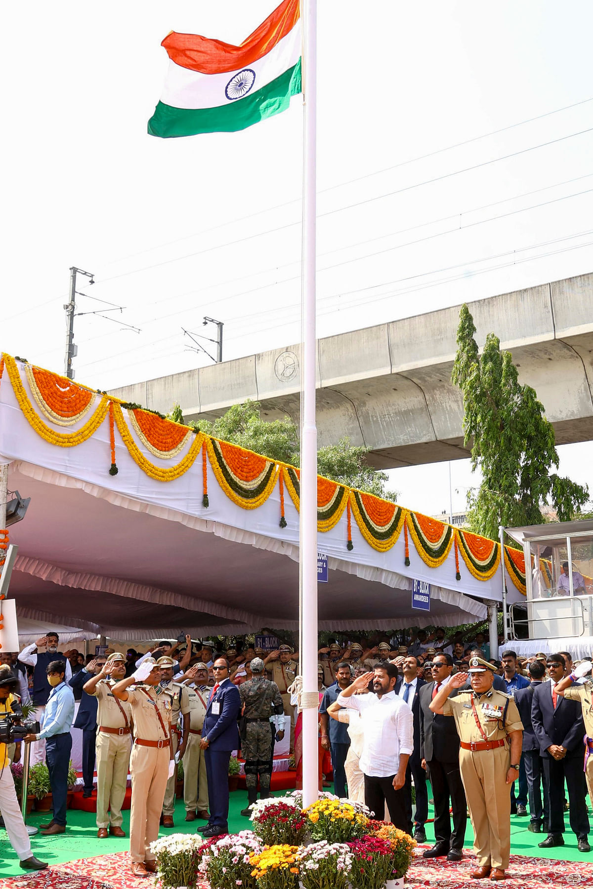  Telangana Chief Minister A. Revanth Reddy hoists the national flag during celebrations of Telangana Formation Day, in Secundrabad, Sunday, June 2, 2024.